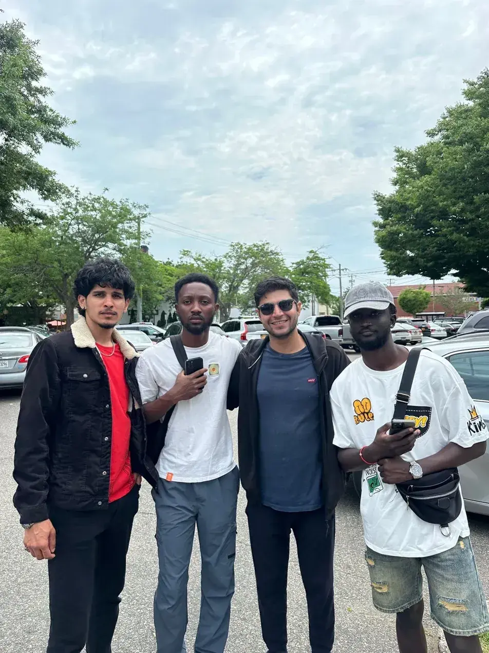 Four camp participants standing together outdoors